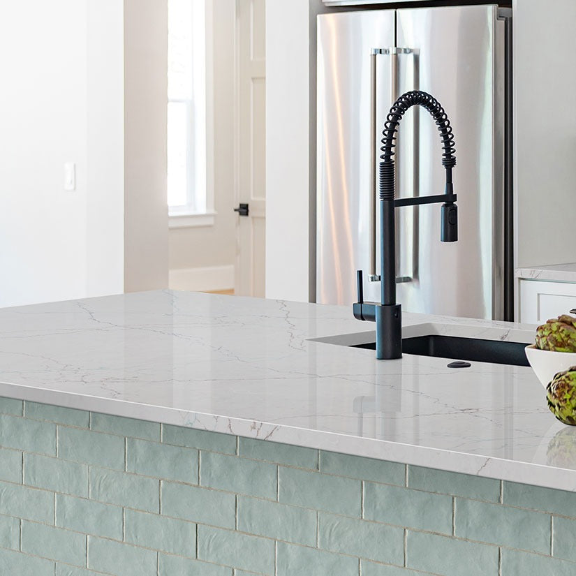 Calacatta Miraggio SeaGlass LumaLuxe Ultra quartz kitchen countertop installed in a room setting