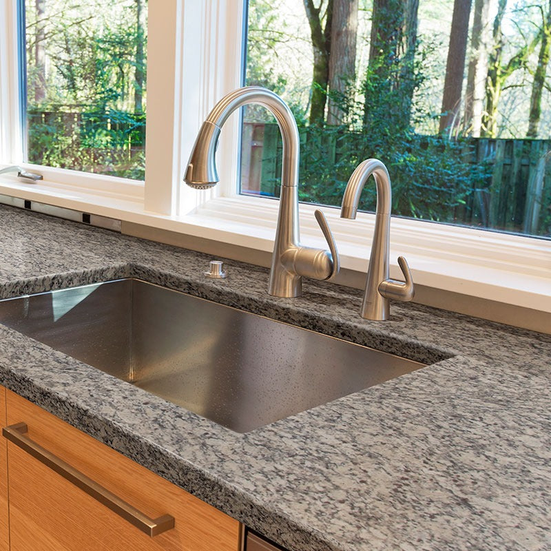 Santa Cecilia LC granite countertop installed in a kitchen