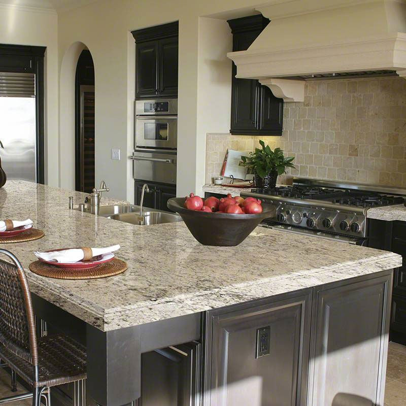 Snowfall granite countertop installed in a kitchen