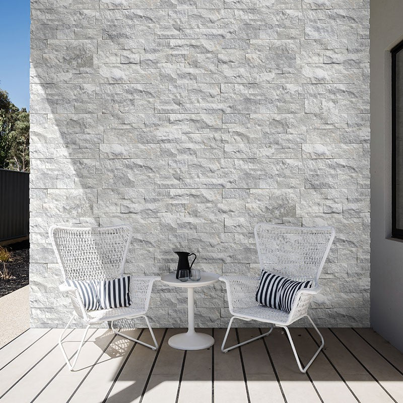 Sierra White Rockmount Stacked Stone Decorative Wall Panels shown installed in a finished outdoor or living space