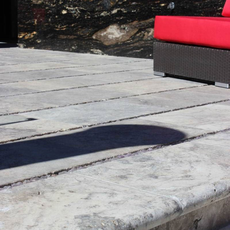 Silver Travertine Pool Coping shown installed in a finished outdoor or living space