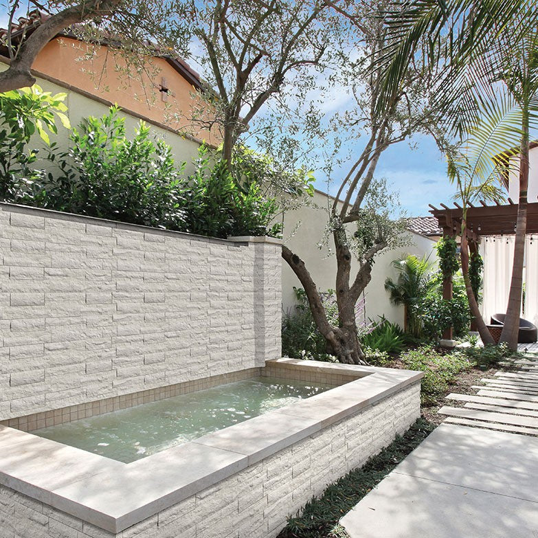 Taja Cream Rockmount Stacked Stone Decorative Wall Panels shown installed in a finished outdoor or living space