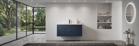 Close-up view of a professionally specified wall-mounted bathroom vanity with a perfectly aligned integrated white acrylic sink top.