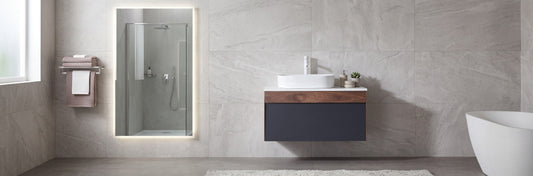 Modern wall-mounted commercial bathroom vanity with an open rear panel and integrated sink for simplified plumbing alignment.