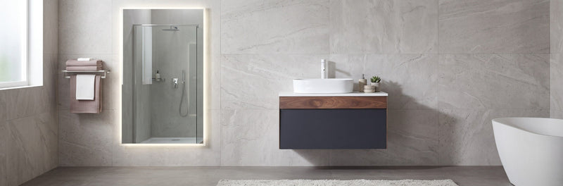Modern wall-mounted commercial bathroom vanity with an open rear panel and integrated sink for simplified plumbing alignment.