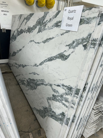 Royal Green quartz slab in the Elite Stone warehouse, white base with bold green veining