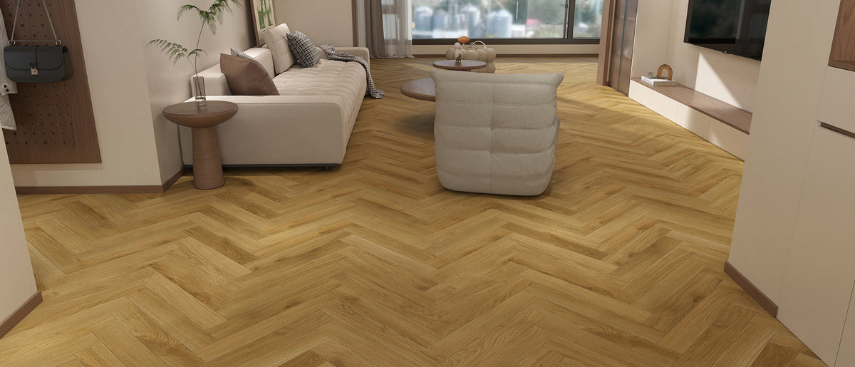 Sessile Oak Herringbone water resistant laminate flooring, golden honey oak in a herringbone layout, 24 by 3-15/16 inch herringbone planks, room setting