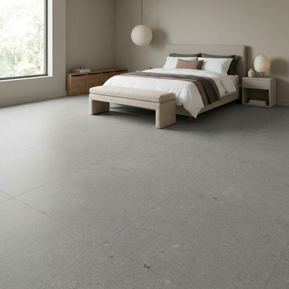 Loften Smoke Limestone LVT Glue Down Flooring installed in a bedroom