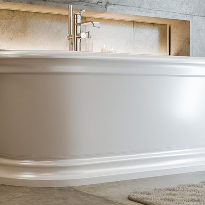 Abbey 67 inch freestanding acrylic bathtub in gloss white with Polished Chrome drain, shown in a styled setting