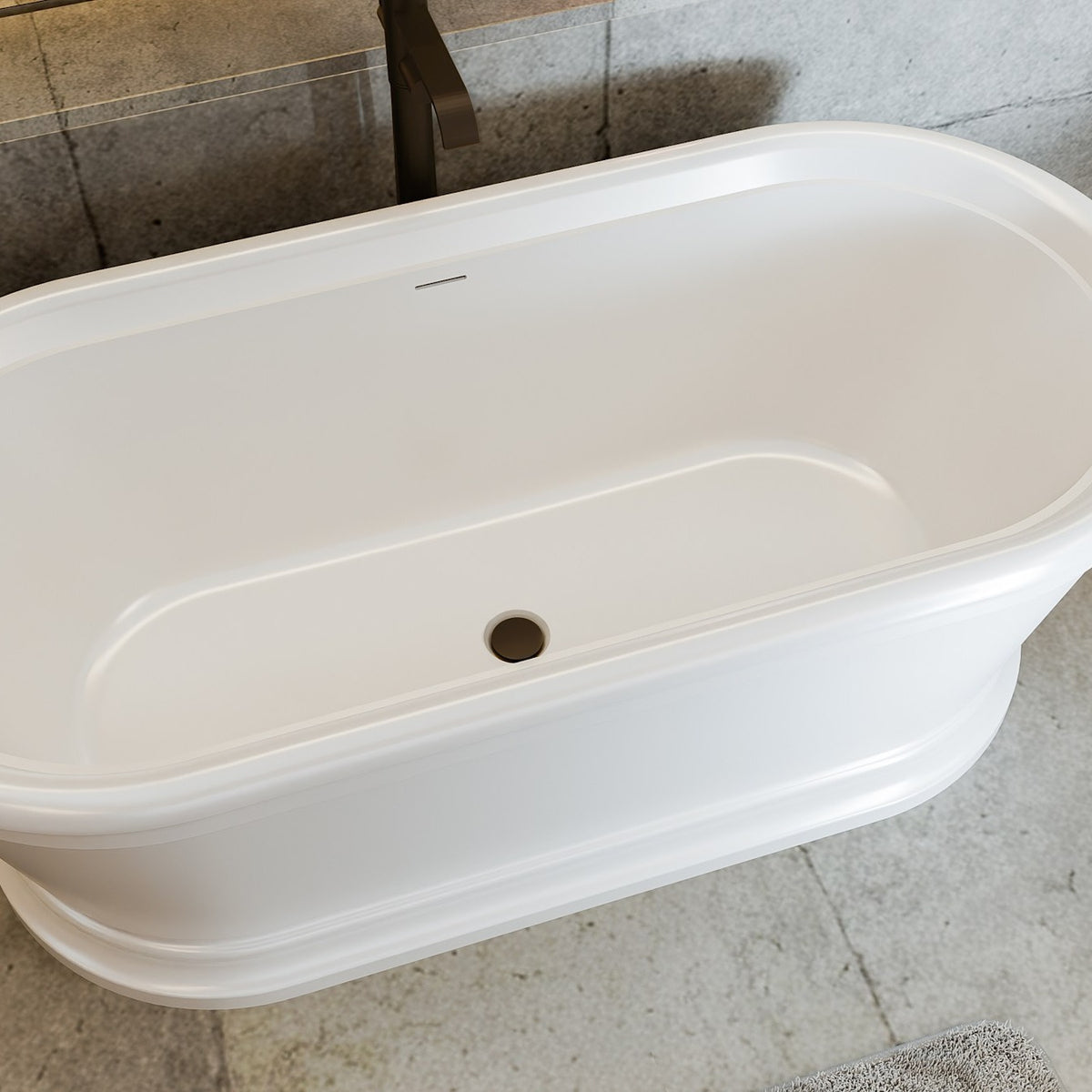 Abbey 67 inch freestanding acrylic bathtub in gloss white with Oil Rubbed Bronze drain, shown in a styled setting