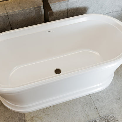 Abbey 67 inch freestanding acrylic bathtub in gloss white with Oil Rubbed Bronze drain, shown in a styled setting