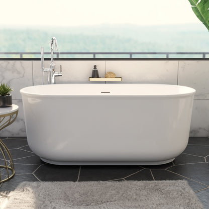 Alliance Pro 67 inch freestanding acrylic bathtub in gloss white with Polished Brass drain, shown in a styled setting