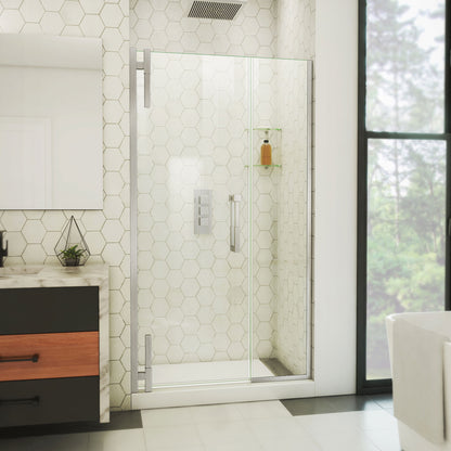 Ascend frameless pivot shower door with inline panel in Brushed Nickel, 40 to 49 1/2 inch width, 3/8 inch clear glass, shown in a bathroom