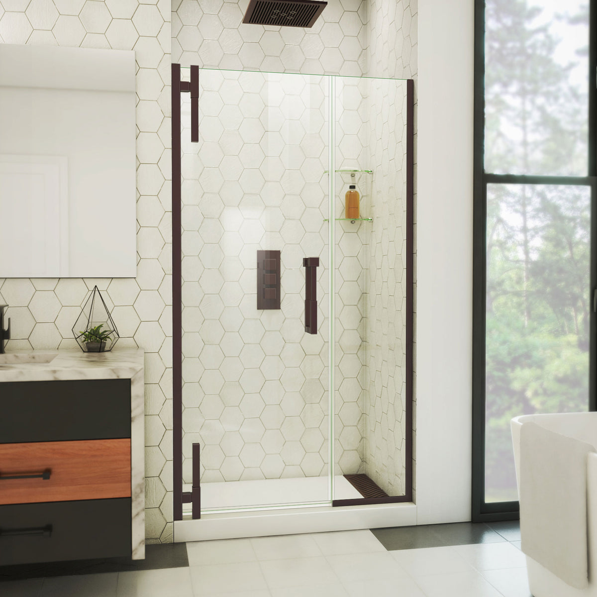 Ascend frameless pivot shower door with inline panel in Oil Rubbed Bronze, 40 to 49 1/2 inch width, 3/8 inch clear glass, shown in a bathroom