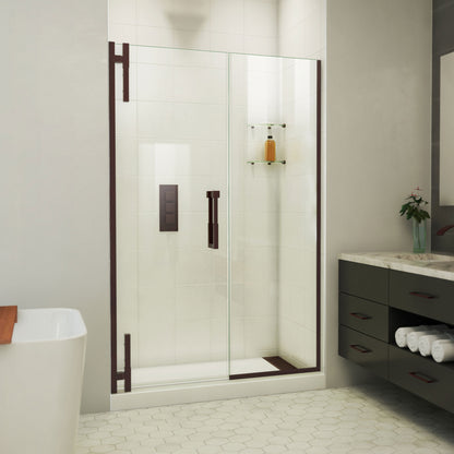 Ascend frameless pivot shower door with inline panel in Oil Rubbed Bronze, 48 to 57 1/2 inch width, 3/8 inch clear glass, shown in a bathroom