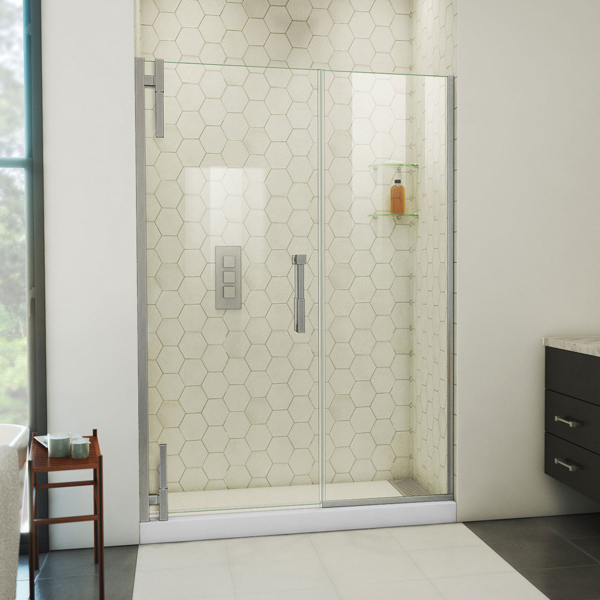 Ascend frameless pivot shower door with inline panel in Brushed Nickel, 48 to 57 1/2 inch width, 3/8 inch clear glass, shown in a bathroom