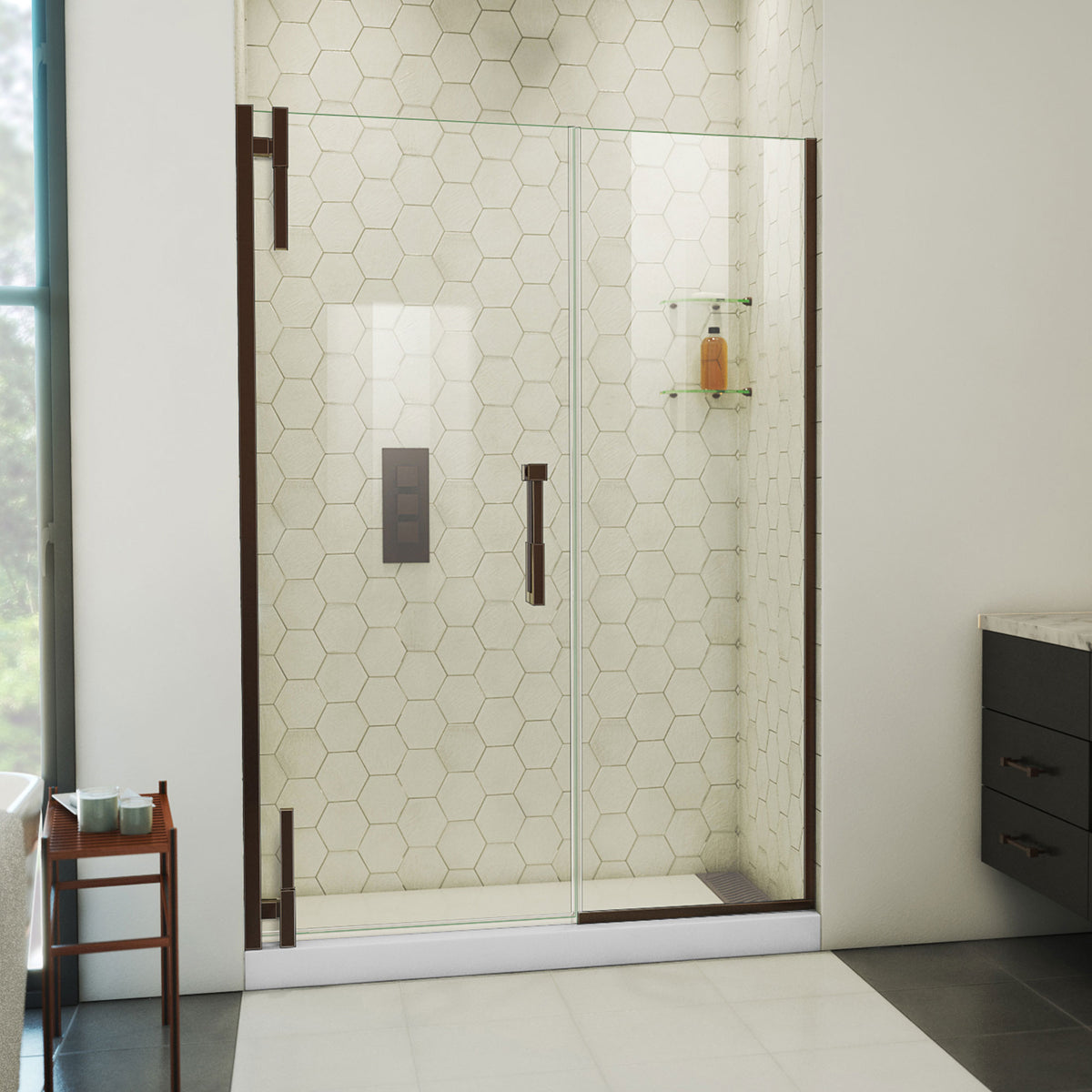 Ascend frameless pivot shower door with inline panel in Oil Rubbed Bronze, 48 to 57 1/2 inch width, 3/8 inch clear glass, shown in a bathroom