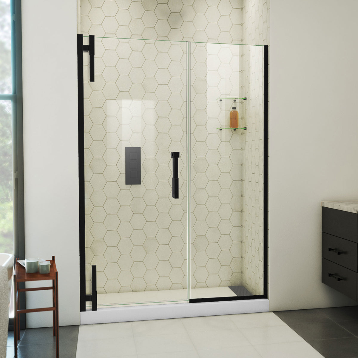 Ascend frameless pivot shower door with inline panel in Satin Black, 48 to 57 1/2 inch width, 3/8 inch clear glass, shown in a bathroom