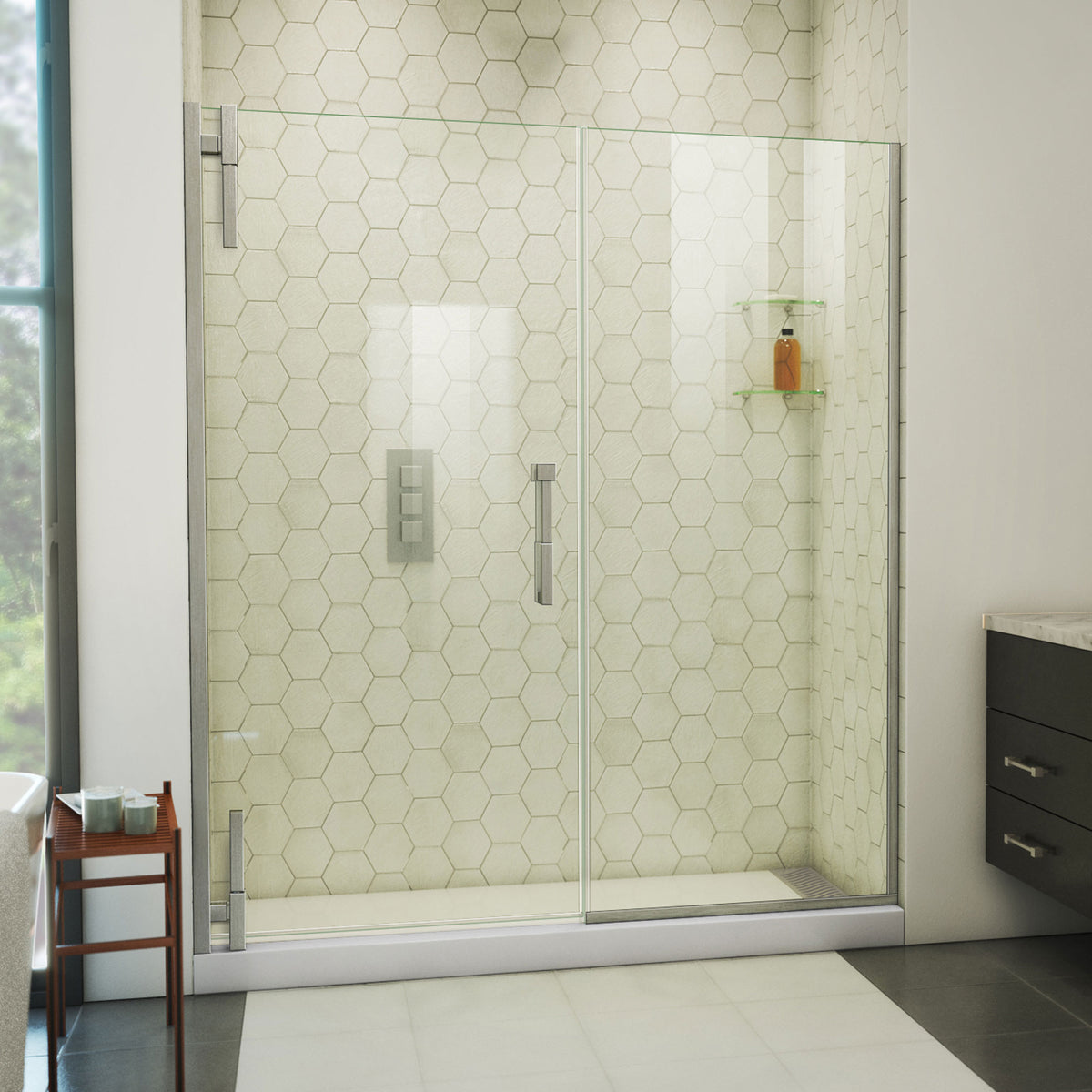 Ascend frameless pivot shower door with inline panel in Brushed Nickel, 56 to 65 1/2 inch width, 3/8 inch clear glass, shown in a bathroom