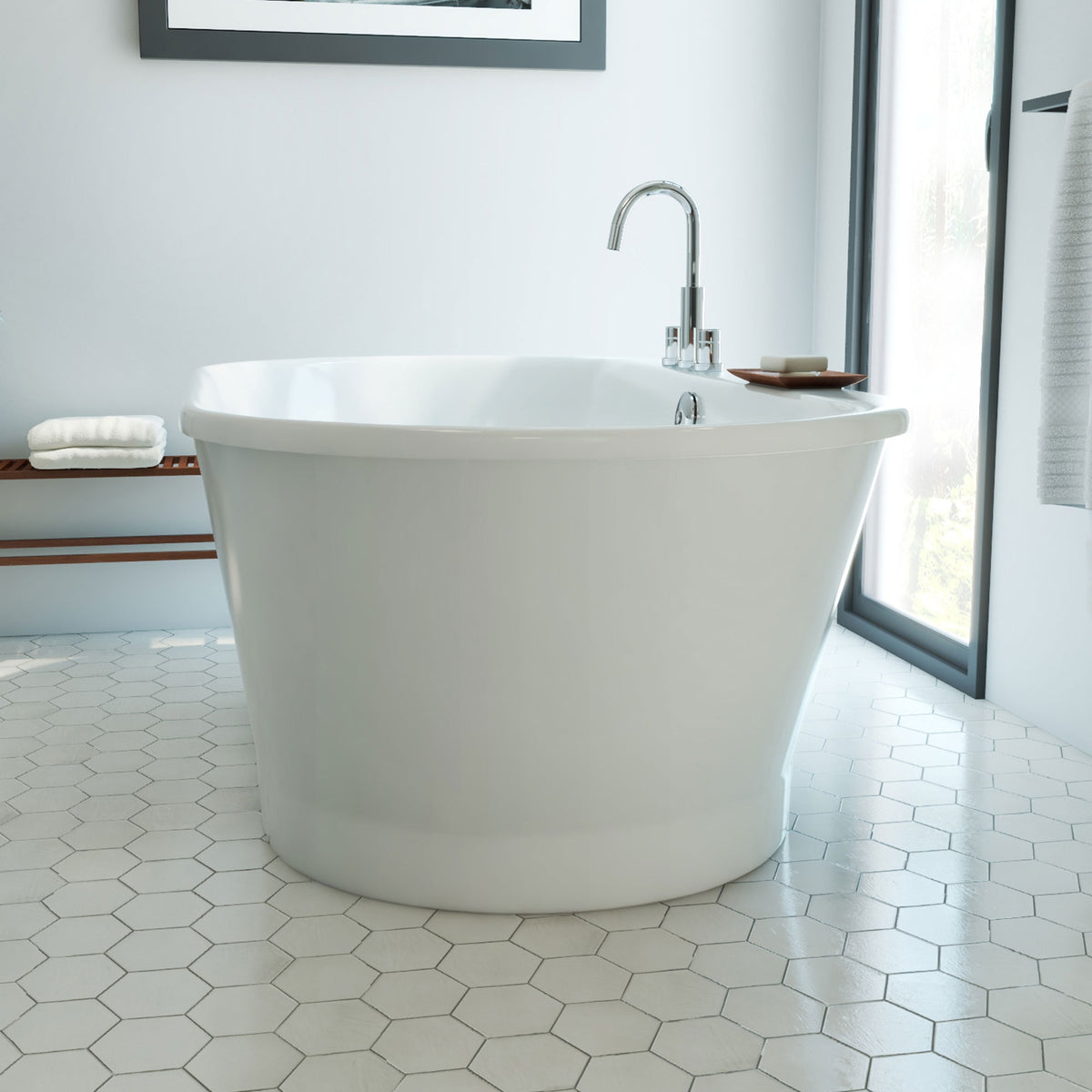 Caribbean 66 inch freestanding acrylic bathtub in gloss white, shown in a styled setting