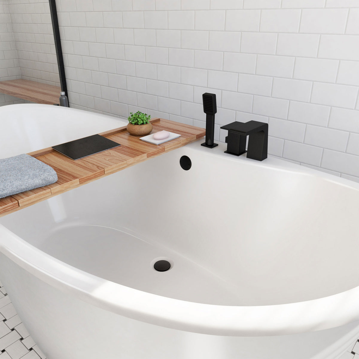Caspian 66 inch freestanding acrylic bathtub in gloss white, shown in a styled setting