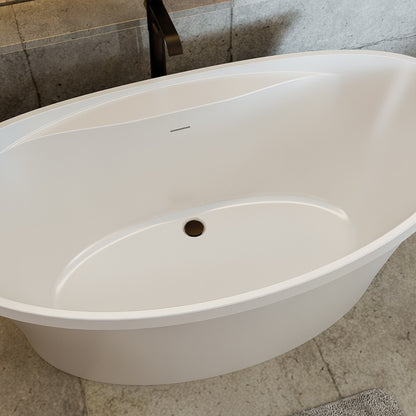 Continuum 66 inch freestanding acrylic bathtub in gloss white with Oil Rubbed Bronze drain, shown in a styled setting