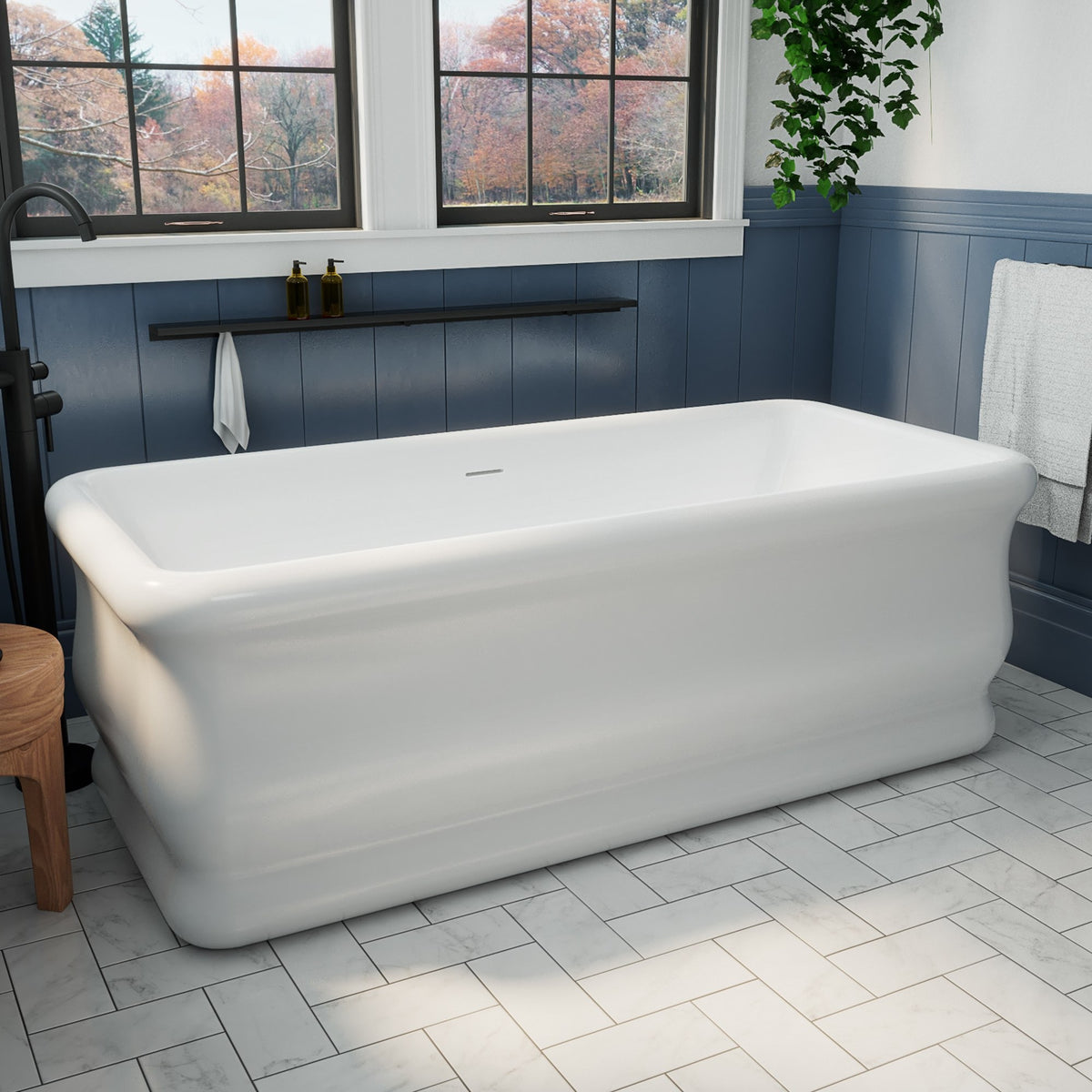Crest 67 inch freestanding acrylic bathtub in gloss white with Polished Nickel drain, shown in a styled setting
