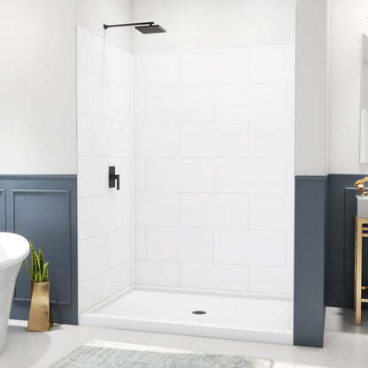 DreamStone modern subway shower wall kit with white solid surface shower base pan installed in a bathroom