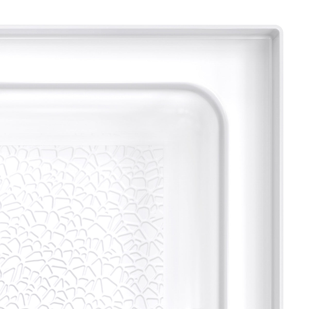 DreamStone single threshold solid surface shower base pan, close up of the corner and slip resistant floor