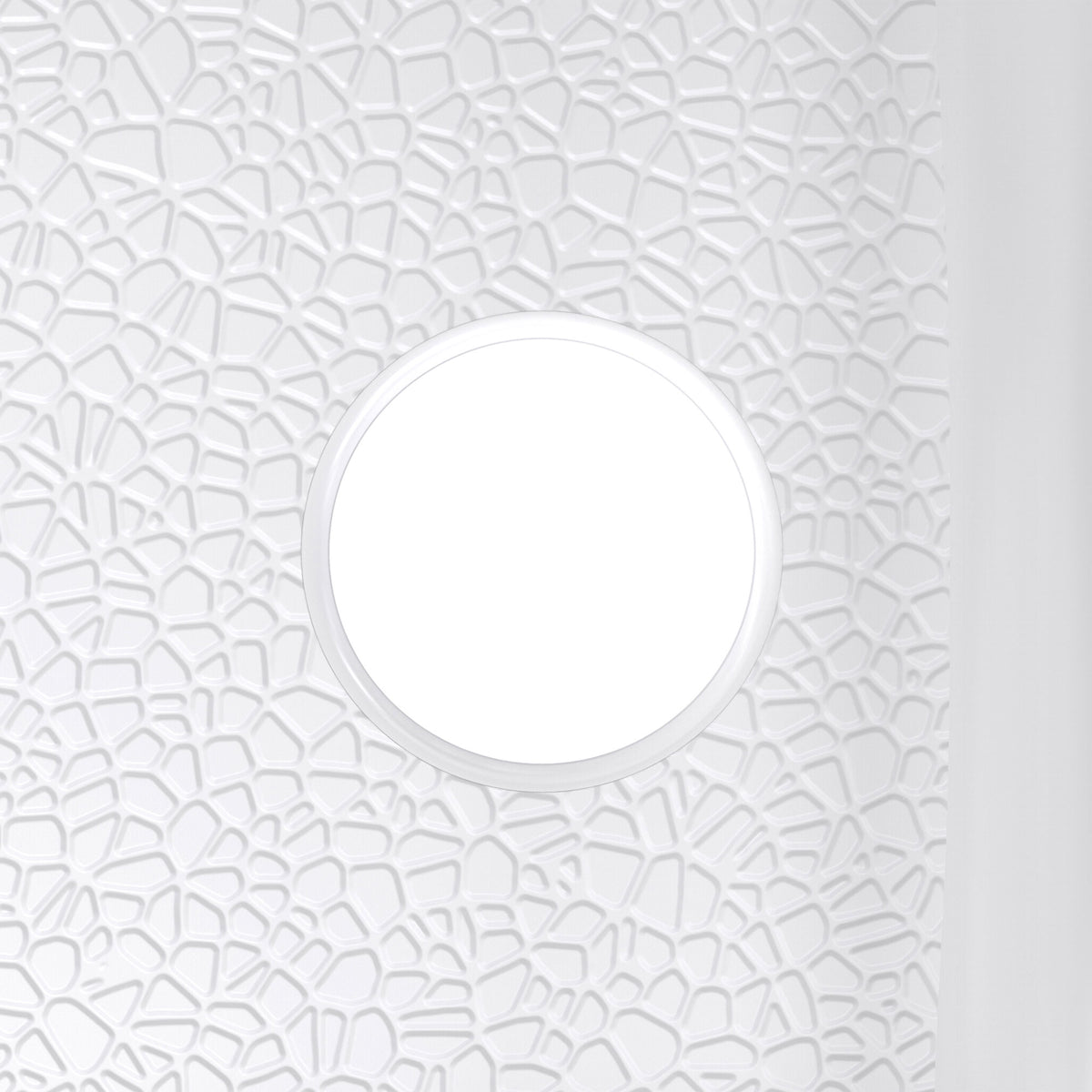DreamStone single threshold solid surface shower base pan, close up of the integral drain and textured floor