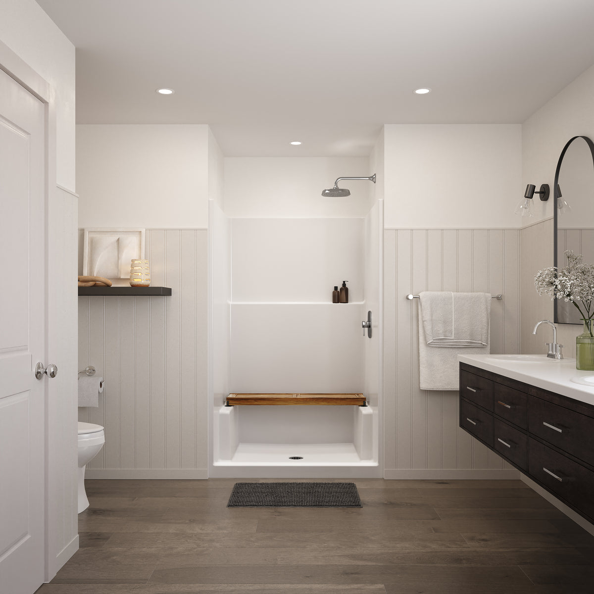 Straight teak shower bench resting across the side ledges of a white shower stall in a bright bathroom