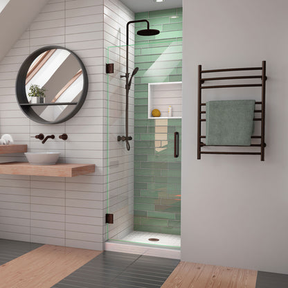 Unidoor-LS Frameless Hinged Shower Door in Oil Rubbed Bronze, installed in a bathroom