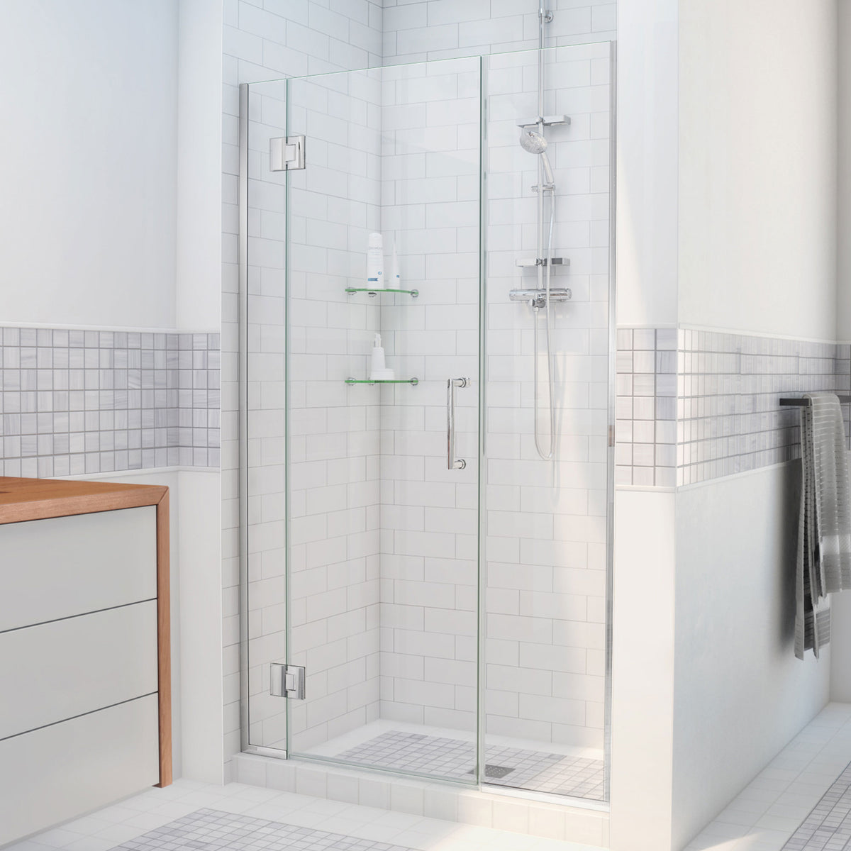 Unidoor-X frameless hinged shower door with 22 inch inline panel shown in a bathroom setting in Polished Chrome