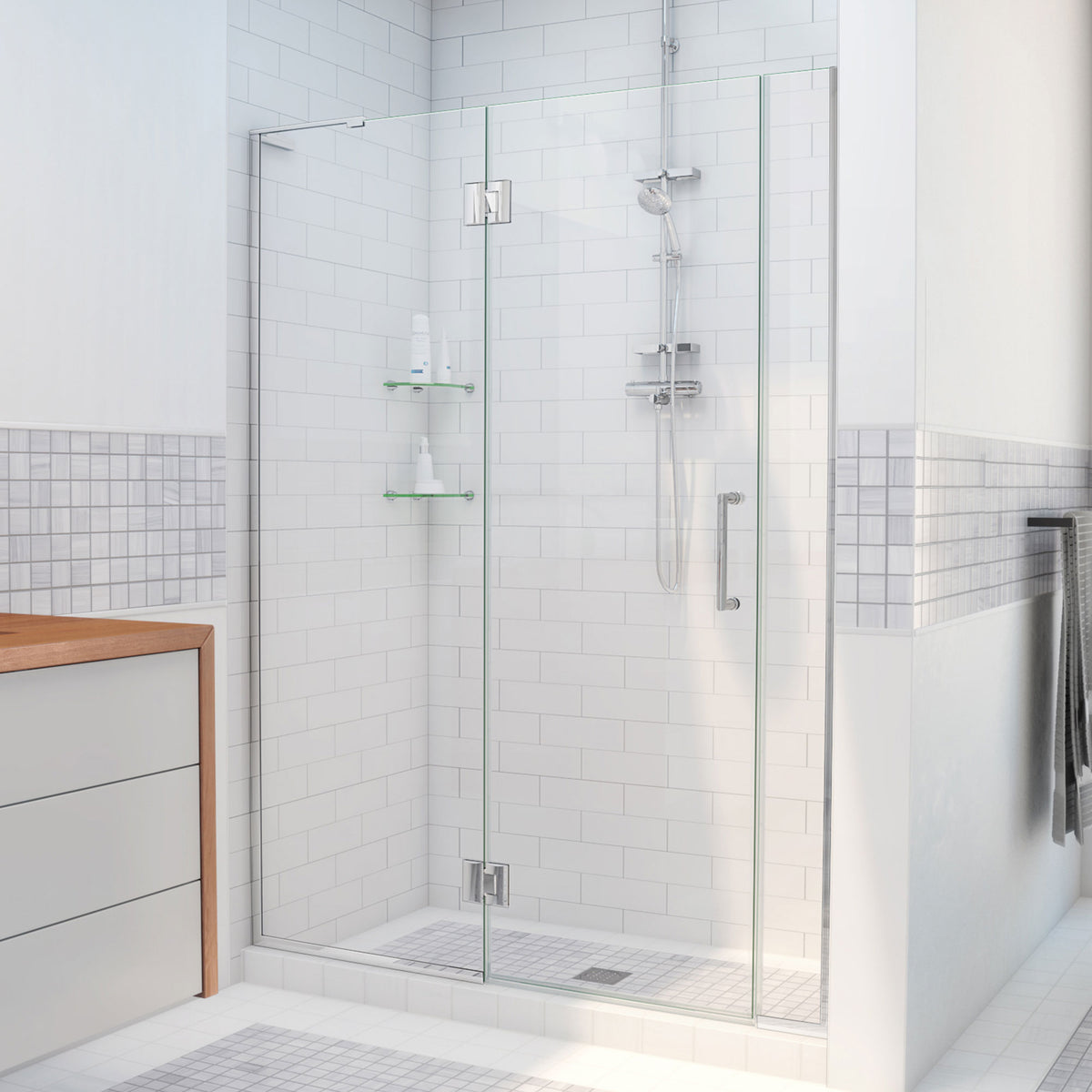 Unidoor-X frameless hinged shower door with 24 inch hinged panel and 6 inch inline panel for left wall installation shown in a bathroom setting in Polished Chrome