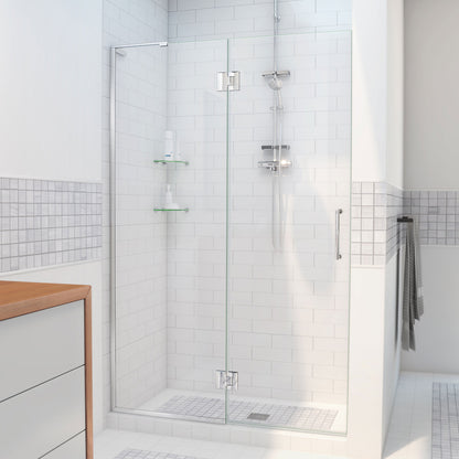 Unidoor-X frameless hinged shower door with 24 inch hinged panel for left wall installation shown in a bathroom setting in Polished Chrome