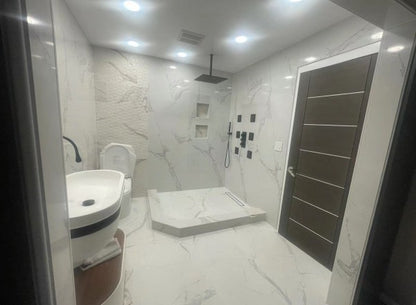 Calacatas Azure marble composite shower wall panel, cool azure gray veining on white