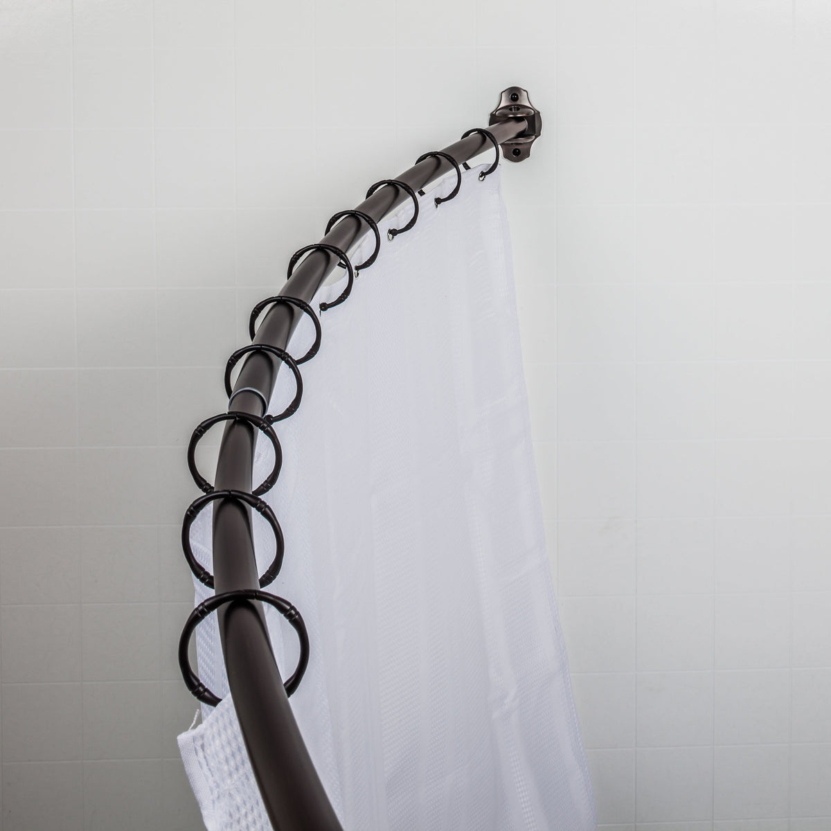 Elements Adjustable Curved Shower Curtain Rod in Brushed Oil Rubbed Bronze