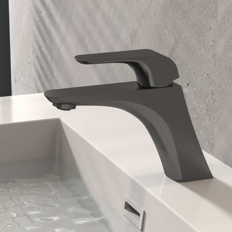 Alfred single hole bathroom faucet in Gunmetal Grey, installed on a bathroom vanity