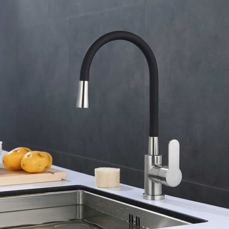 Bertil kitchen faucet with flexible black spout, installed over a kitchen sink