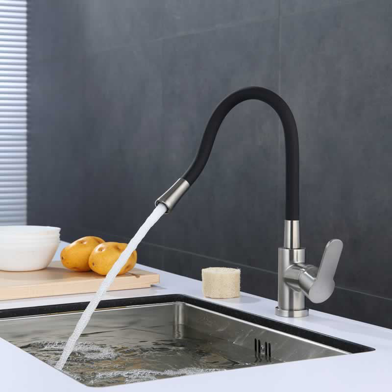 Bertil kitchen faucet with flexible black spout in Brushed Nickel with Matte Black Spout, installed over a kitchen sink
