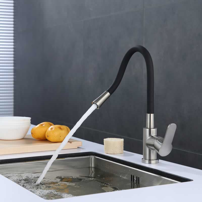 Bertil kitchen faucet with flexible black spout in Brushed Nickel with Matte Black Spout, installed over a kitchen sink
