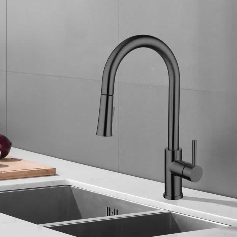 Halvard pull down kitchen faucet in Gunmetal Grey, installed over a kitchen sink