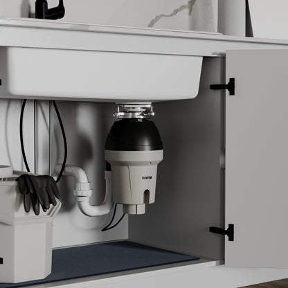 Ashworth continuous feed kitchen garbage disposal, 1-1/4 HP, installed under a kitchen sink