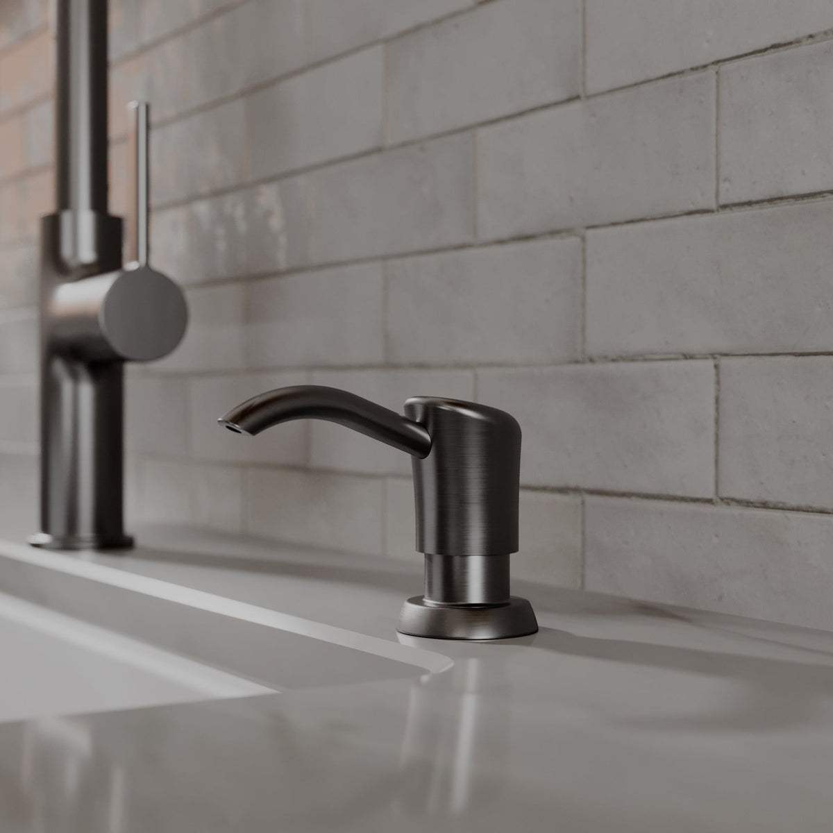 Ludlow kitchen soap dispenser in Spot-Free Gunmetal Grey, installed beside a kitchen faucet