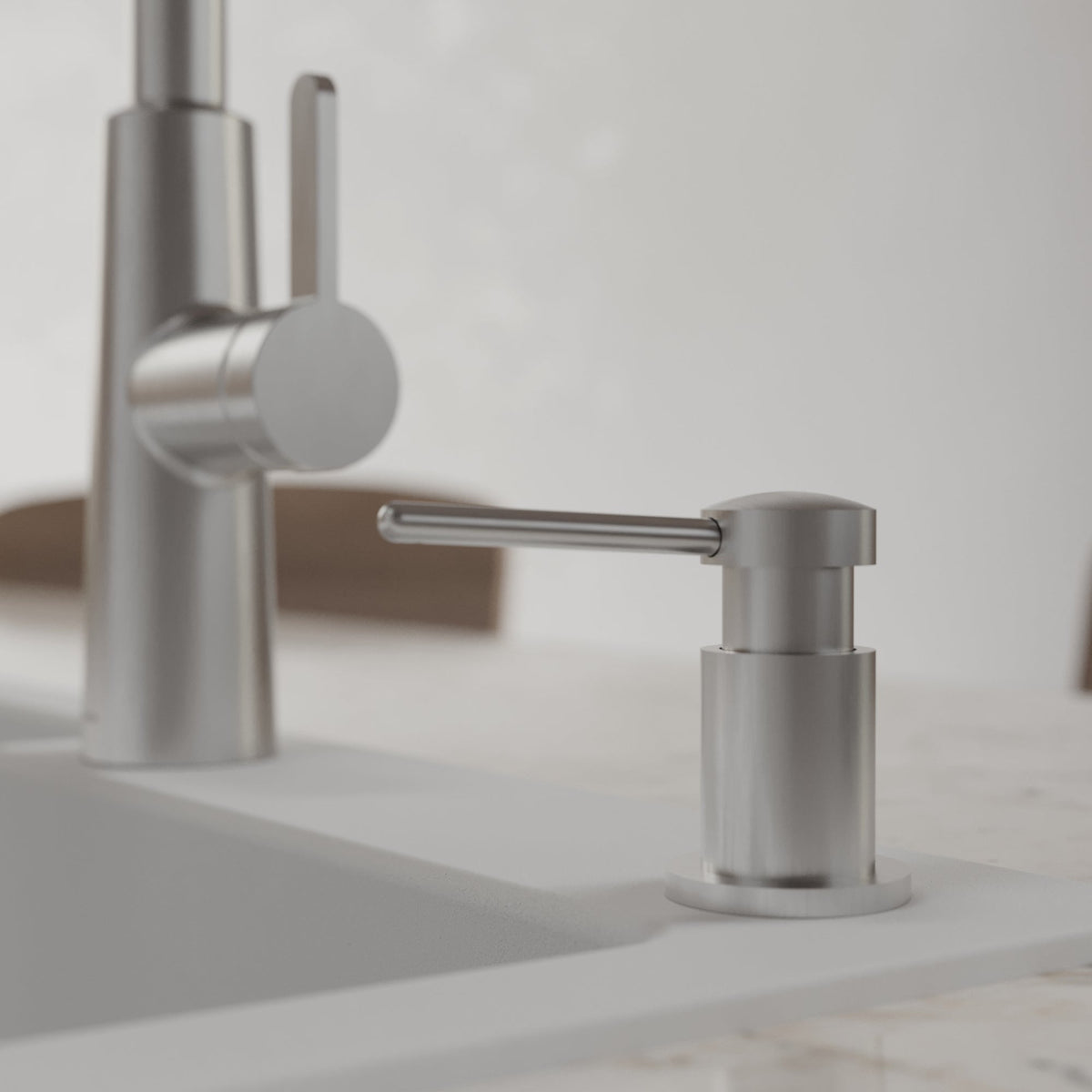 Pembrey kitchen soap dispenser in Spot-Free Stainless Steel, installed beside a kitchen faucet