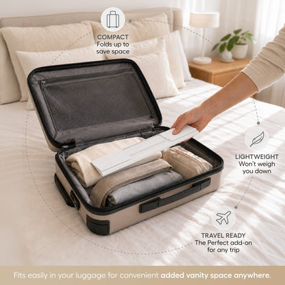 Roll up silicone vanity bowl mat in White, packed in a suitcase for travel