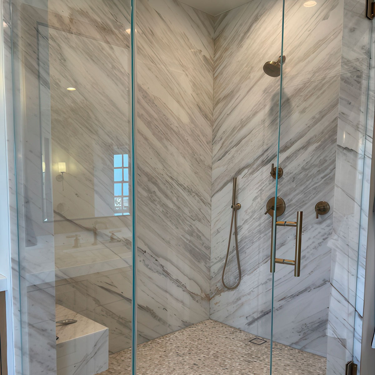 Athena Gold Penny Round Marble Mosaic installed in a finished room
