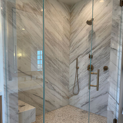 Athena Gold Penny Round Marble Mosaic installed in a finished room