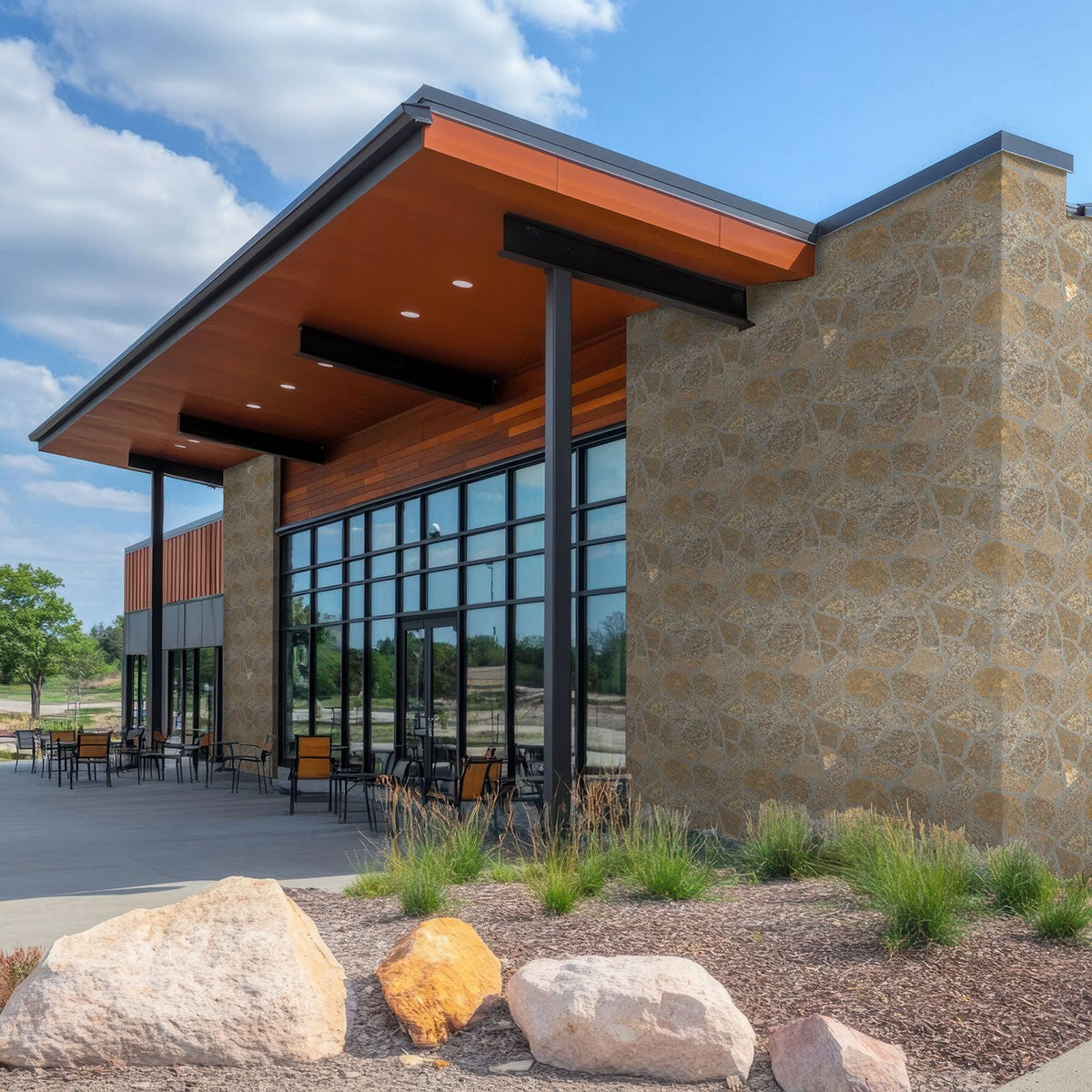 Bedford Brown Fieldstone Rockmount Stone Veneer Decorative Wall Panels shown installed in a finished outdoor or living space