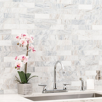 Capri Blue 2x6 Subway Marble Mosaic installed in a finished room